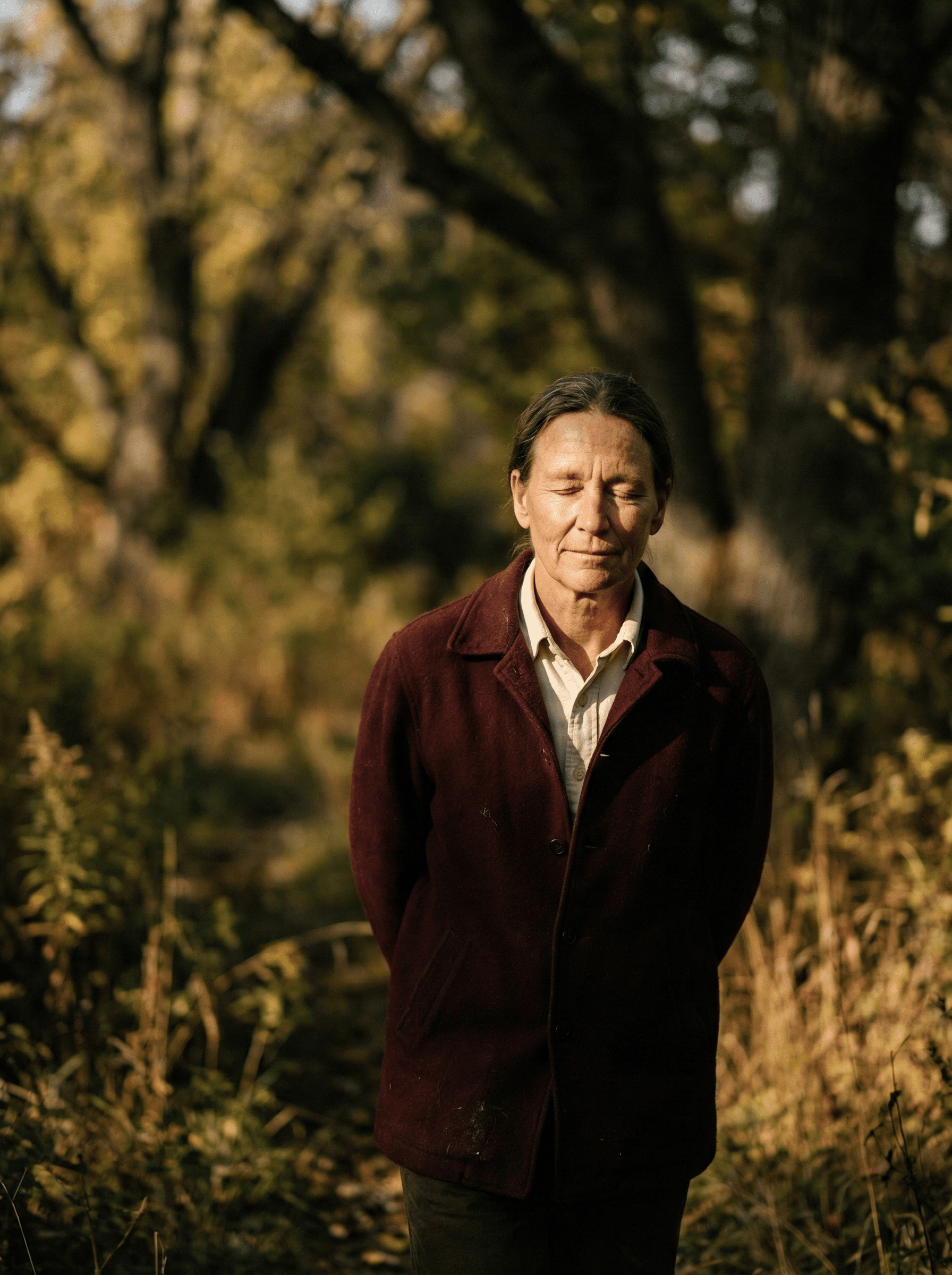 Person walking outdoors with peaceful expression, eyes closed, apparently reciting from memory while surrounded by nature